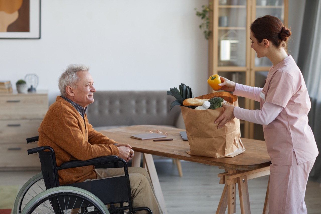 Caregiver unpacking groceries